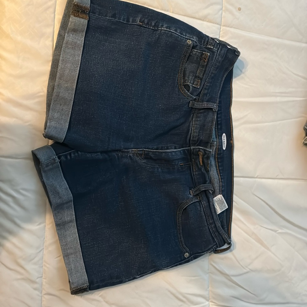 Medium to dark wash denim shorts with cuffing